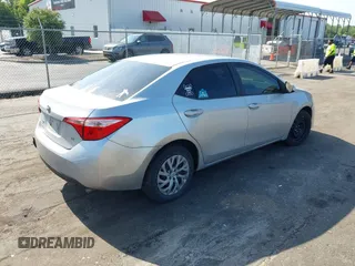 2018 Toyota Corolla L with VIN 5YFBURHEXJP810003, listed as a IAAI auction lot 42526648 with 84,546 mi miles and . Bid and sale history available at DreamBid. Image 4.
