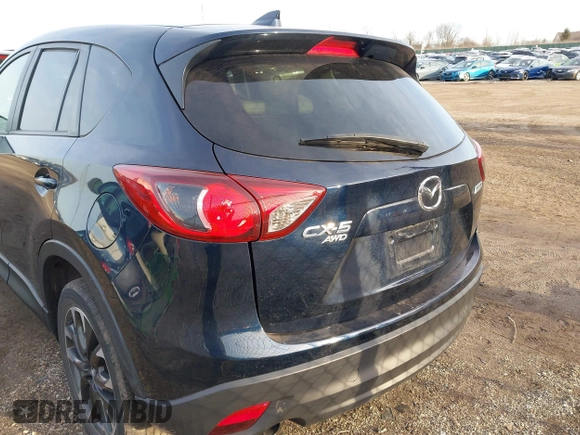 2016 Mazda CX-5 Grand Touring with VIN JM3KE4DY1G0823989, listed as a IAAI auction lot 41770149 with 40,677 mi miles. Bid and sale history available at carsss.com. Image 16.