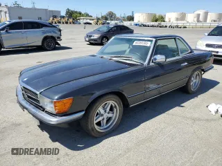 1985 Mercedes-Benz SL with VIN WDB1070461A026562, listed as a Copart auction lot 60354385 with 33,243 mi miles and Clean title. Bid and sale history available at DreamBid. Image 1.