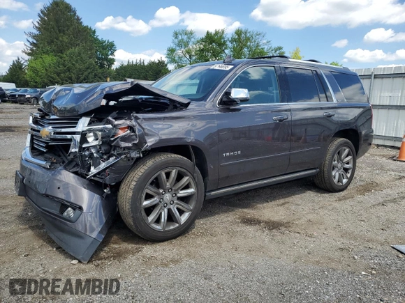 2015 Chevrolet Tahoe LTZ with VIN 1GNSKCKC9FR698924, listed as a Copart auction lot 56196895 with 184,740 mi miles and Salvage title. Bid and sale history available at DreamBid. Image 1.
