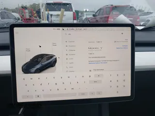 2025 Tesla Model Y Long Range with VIN 7SAYGDED8SA340082, listed as a IAAI auction lot 41915369 with 7,296 mi miles and . Bid and sale history available at carsss.com. Image 19.