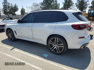 2019 BMW X5 xDrive40i with VIN 5UXCR6C57KLK85504, listed as a Copart auction lot 60908665 with 21,333 mi miles and Salvage title. Bid and sale history available at DreamBid. Image 2.
