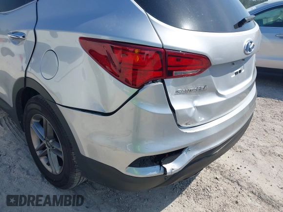 2018 Hyundai Santa Fe 2.4L z VIN 5XYZTDLB9JG513584, wystawiony jako IAAI lot #42031291 z przebiegiem 131 109 mil mil oraz . Historia ofert i sprzedaży dostępna na DreamBid. Obrazek 6.