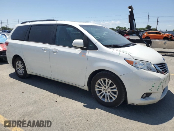 2015 Toyota Sienna XLE with VIN 5TDYK3DC1FS690219, listed as a Copart auction lot 60926525 with 97,879 mi miles and Salvage title. Bid and sale history available at DreamBid. Image 4.