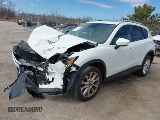 2014 Mazda CX-5 Grand Touring with VIN JM3KE4DY8E0397330, listed as a IAAI auction lot 41868116 with 180,891 mi miles. Bid and sale history available at carsss.com. Image 2.