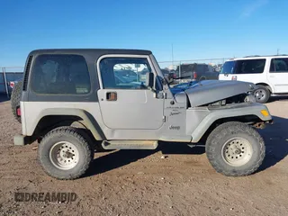2001 Jeep Wrangler Sport with VIN 1J4FA49S91P324912, listed as a IAAI auction lot 41261214 with 260,299 mi miles. Bid and sale history available at carsss.com. Image 13.