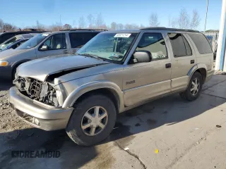 2000 Oldsmobile Bravada z VIN 1GHDT13WXY2255649, wystawiony jako Copart lot #80021214 z przebiegiem Nie podano mil oraz Szkody całkowita. Historia ofert i sprzedaży dostępna na DreamBid. Obrazek 1.