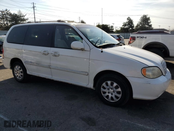 2005 Kia Sedona LX with VIN KNDUP132056685525, listed as a Copart auction lot 77790354 with 60,985 mi miles and Salvage Title. Bid and sale history available at carsss.com. Image 4.
