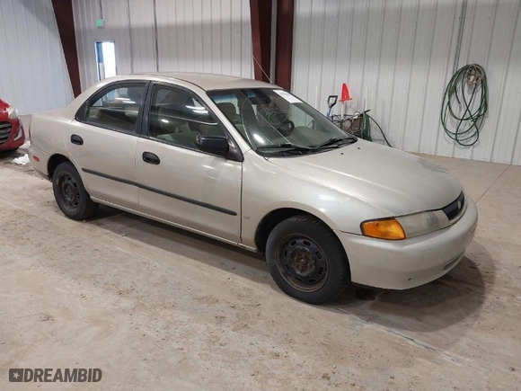 1997 Mazda Protege DX with VIN JM1BC141XV0113096, listed as a IAAI auction lot 41834308 with NaN miles. Bid and sale history available at carsss.com. Image 1.