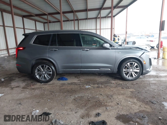2022 Cadillac XT6 Premium Luxury z VIN 1GYKPDRS1NZ108012, wystawiony jako IAAI lot #41178333 z przebiegiem 83 987 mil mil oraz . Historia ofert i sprzedaży dostępna na DreamBid. Obrazek 13.