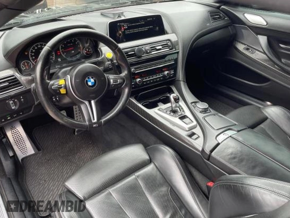 2016 BMW M6 z VIN WBS6G9C54GD932196, wystawiony jako Copart lot #53960063 z przebiegiem 46 162 mil mil oraz . Historia ofert i sprzedaży dostępna na DreamBid. Obrazek 9.