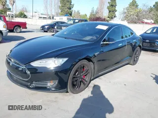 2014 Tesla Model S P85D with VIN 5YJSA1H22EFP65530, listed as a IAAI auction lot 41959941 with 76,532 mi miles and . Bid and sale history available at DreamBid. Image 2.