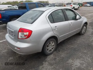2013 Suzuki SX4 LE with VIN JS2YC5A36D6100791, listed as a IAAI auction lot 41909191 with 180,597 mi miles and . Bid and sale history available at DreamBid. Image 4.