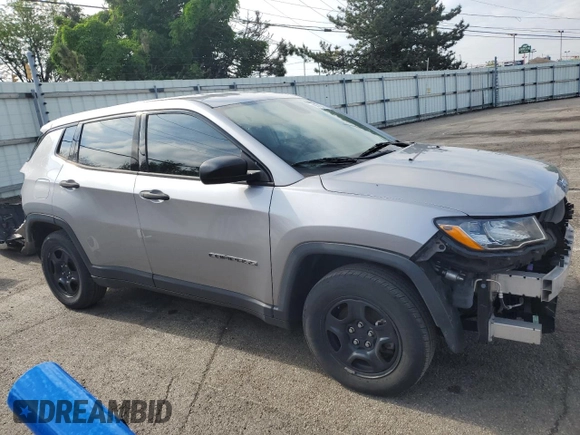 2018 Jeep Compass Sport with VIN 3C4NJCAB5JT272312, listed as a Copart auction lot 56700395 with 131,693 mi miles and Salvage title. Bid and sale history available at DreamBid. Image 4.
