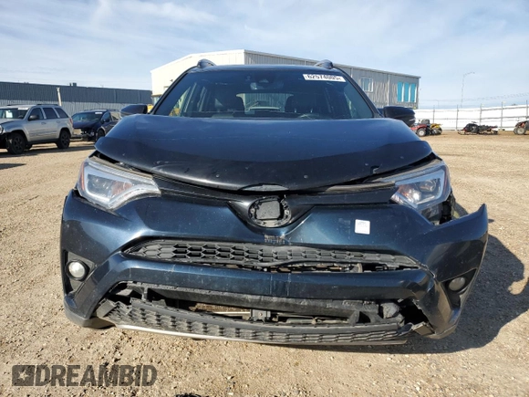 2018 Toyota RAV4 Hybrid SE with VIN JTMJJREV2JD230126, listed as a Copart auction lot 62574005 with 196,846 mi miles and Salvage title. Bid and sale history available at DreamBid. Image 5.
