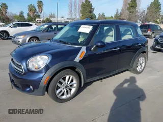 2014 MINI Countryman with VIN WMWZB3C50EWR42268, listed as a IAAI auction lot 41845750 with 117,192 mi miles and . Bid and sale history available at DreamBid. Image 2.