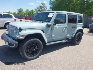 2023 Jeep Wrangler Sahara with VIN 1C4JJXP68PW627007, listed as a IAAI auction lot 42474745 with 57,912 mi miles and . Bid and sale history available at DreamBid. Image 17.