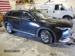 2021 Mazda CX-9 Grand Touring with VIN JM3TCBDY5M0512429, listed as a Copart auction lot 44445625 with 64,989 mi miles and Salvage title. Bid and sale history available at DreamBid. Image 4.