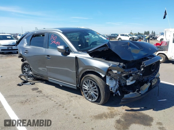 2019 Mazda CX-5 Touring with VIN JM3KFACM1K0533142, listed as a IAAI auction lot 41880181 with Not Provided miles and . Bid and sale history available at carsss.com. Image 1.