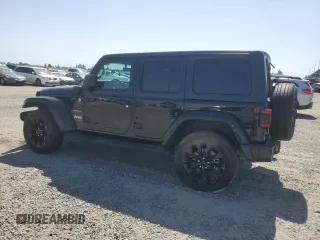 2023 Jeep Wrangler Sahara with VIN 1C4JJXP61PW512975, listed as a Copart auction lot 59392075 with 26,954 mi miles and Salvage title. Bid and sale history available at DreamBid. Image 2.