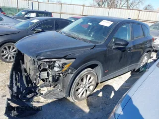 2013 Mazda CX-5 Grand Touring with VIN JM3KE2DE1D0164723, listed as a IAAI auction lot 41364590 with 227,932 mi miles. Bid and sale history available at carsss.com. Image 2.