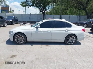 2014 BMW 3 Series 328i with VIN WBA3A5C54EP600398, listed as a IAAI auction lot 42665302 with 117,012 mi miles and . Bid and sale history available at DreamBid. Image 14.
