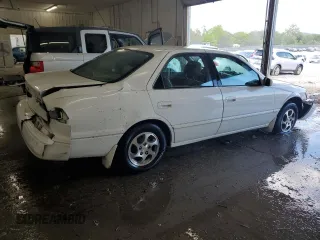 1999 Toyota Camry LE z VIN JT2BG22K3X0317823, wystawiony jako Copart lot #58203965 z przebiegiem 167 587 mil mil oraz Szkoda całkowita • Salvage title. Historia ofert i sprzedaży dostępna na DreamBid. Obrazek 3.