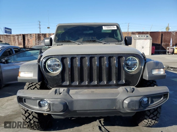 2020 Jeep Wrangler Unlimited Willys with VIN 1C4HJXDG5LW348507, listed as a Copart auction lot 77000574 with 57,056 mi miles and Salvage title. Bid and sale history available at DreamBid. Image 5.