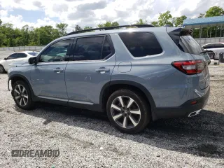 2023 Honda Pilot Touring with VIN 5FNYG2H78PB006054, listed as a Copart auction lot 56039785 with 35,831 mi miles and Salvage title. Bid and sale history available at DreamBid. Image 2.