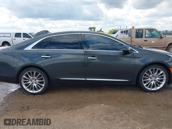 2013 Cadillac XTS Platinum z VIN 2G61V5S32D9102537, wystawiony jako IAAI lot #42230895 z przebiegiem 120 810 mil mil oraz . Historia ofert i sprzedaży dostępna na DreamBid. Obrazek 13.