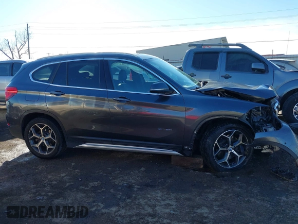 2017 BMW X1 sDrive28i with VIN WBXHU7C30H5H32753, listed as a IAAI auction lot 41441791 with 100,072 mi miles. Bid and sale history available at carsss.com. Image 14.