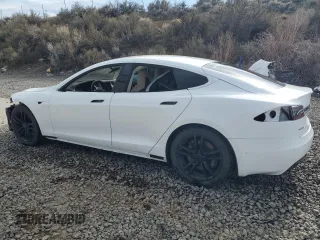 2016 Tesla Model S 90D with VIN 5YJSA1E27GF142380, listed as a Copart auction lot 50661905 with 104,865 mi miles and Salvage Title. Bid and sale history available at DreamBid. Image 2.