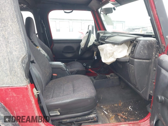 2002 Jeep Wrangler X z VIN 1J4FA39S52P708519, wystawiony jako IAAI lot #41569747 z przebiegiem 219 168 mil mil oraz . Historia ofert i sprzedaży dostępna na DreamBid. Obrazek 5.
