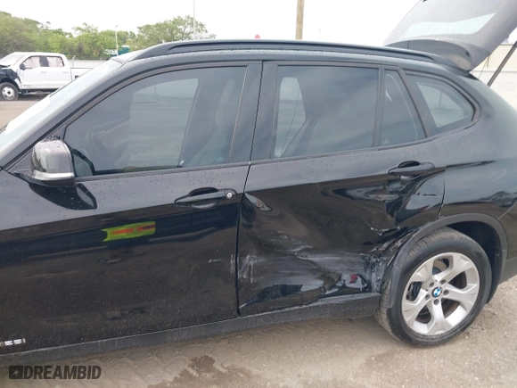 2014 BMW X1 sDrive28i with VIN WBAVM1C54EVW46561, listed as a IAAI auction lot 41880387 with 125,096 mi miles. Bid and sale history available at carsss.com. Image 6.