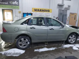 2007 Ford Focus S z VIN 1FAHP34N17W104080, wystawiony jako IAAI lot #41541274 z przebiegiem 106 938 mil mil oraz . Historia ofert i sprzedaży dostępna na DreamBid. Obrazek 13.