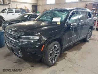 2021 Jeep Grand Cherokee L Overland with VIN 1C4RJKDG8M8164904, listed as a IAAI auction lot 41352092 with 57,707 mi miles. Bid and sale history available at carsss.com. Image 2.