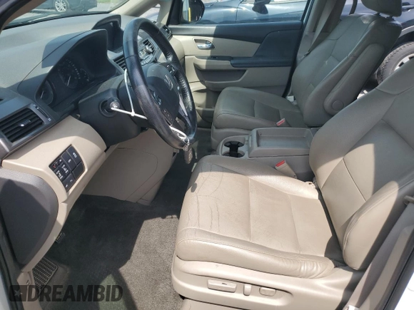 2014 Honda Odyssey Touring with VIN 5FNRL5H94EB080815, listed as a Copart auction lot 65244325 with 153,314 mi miles and Salvage title. Bid and sale history available at DreamBid. Image 7.