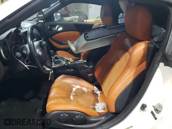 2012 Nissan 370Z z VIN JN1AZ4EH2CM564443, wystawiony jako Copart lot #45126885 z przebiegiem 71 729 mil mil oraz Szkody całkowita. Historia ofert i sprzedaży dostępna na DreamBid. Obrazek 7.