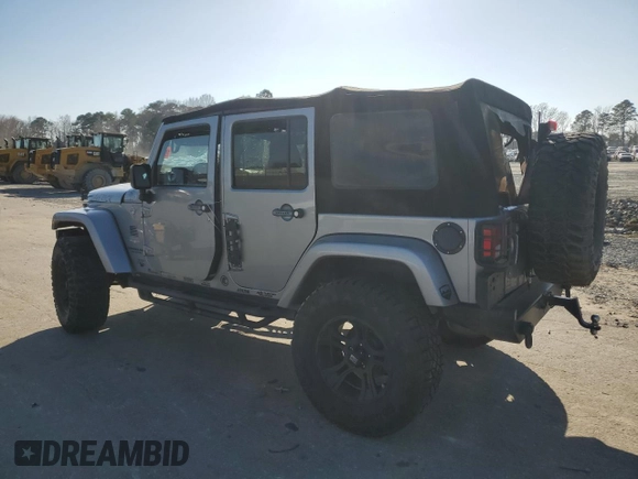 2015 Jeep Wrangler Unlimited Wrangler X with VIN 1C4BJWEG7FL580885, listed as a Copart auction lot 48891605 with 104,448 mi miles and Salvage title. Bid and sale history available at DreamBid. Image 2.