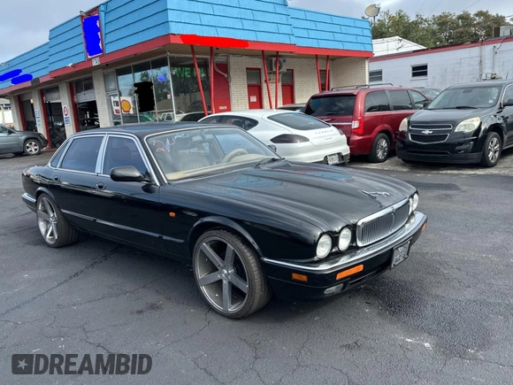 1995 Jaguar XJ with VIN SAJHX174XSC738291, listed as a Copart auction lot 87054224 with 71,076 mi miles and Clean title. Bid and sale history available at DreamBid. Image 1.