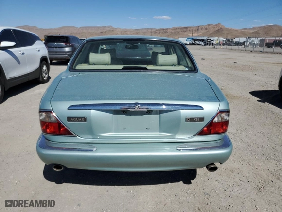 2000 Jaguar XJ with VIN SAJDA14C1YLF10459, listed as a Copart auction lot 65583394 with 113,333 mi miles and Salvage Title. Bid and sale history available at carsss.com. Image 6.