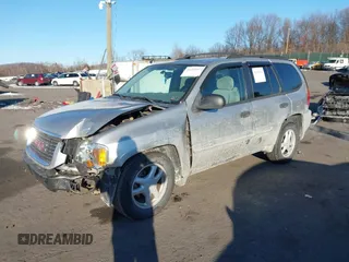 2005 GMC Envoy SLE with VIN 1GKDT13S452194933, listed as a IAAI auction lot 41426512 with 176,897 mi miles. Bid and sale history available at carsss.com. Image 2.