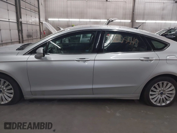 2013 Ford Fusion SE Hybrid with VIN 3FA6P0LU7DR228691, listed as a IAAI auction lot 42055540 with 144,389 mi miles and . Bid and sale history available at DreamBid. Image 14.