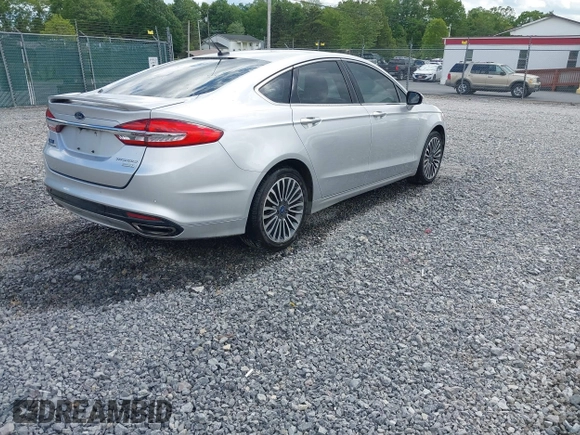 2017 Ford Fusion Titanium with VIN 3FA6P0K99HR112234, listed as a IAAI auction lot 42332700 with 106,685 mi miles and . Bid and sale history available at DreamBid. Image 4.