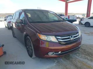 2014 Honda Odyssey Touring with VIN 5FNRL5H90EB080889, listed as a IAAI auction lot 42085305 with 123,286 mi miles and . Bid and sale history available at carsss.com. Image 1.