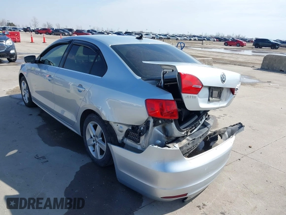 2014 Volkswagen Jetta TDI w/Premium with VIN 3VWLL7AJ6EM424935, listed as a IAAI auction lot 41533634 with 64,028 mi miles and . Bid and sale history available at DreamBid. Image 3.