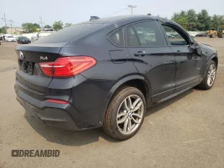 2015 BMW X4 xDrive35i with VIN 5UXXW5C59F0E87517, listed as a Copart auction lot 59604445 with 185,064 mi miles and Salvage title. Bid and sale history available at DreamBid. Image 3.