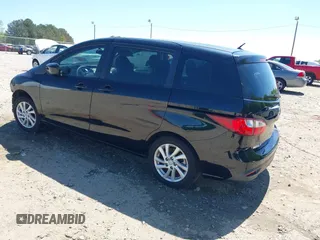 2012 Mazda 5 Sport with VIN JM1CW2BL4C0104669, listed as a IAAI auction lot 42048877 with 115,660 mi miles and . Bid and sale history available at DreamBid. Image 3.