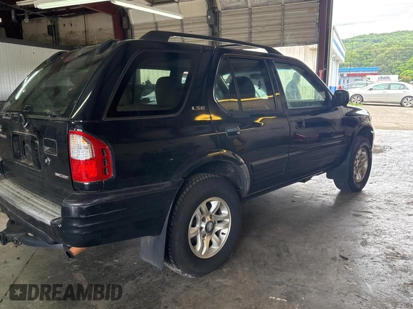 2002 Isuzu Rodeo S with VIN 4S2CK58W124336947, listed as a Copart auction lot 63482935 with 248,008 mi miles and Clean title. Bid and sale history available at DreamBid. Image 4.