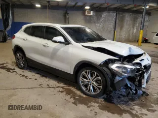 2022 BMW X2 xDrive28i with VIN WBXYJ1C03N5T55985, listed as a Copart auction lot 87183574 with 33,134 mi miles and Salvage Title. Bid and sale history available at carsss.com. Image 4.
